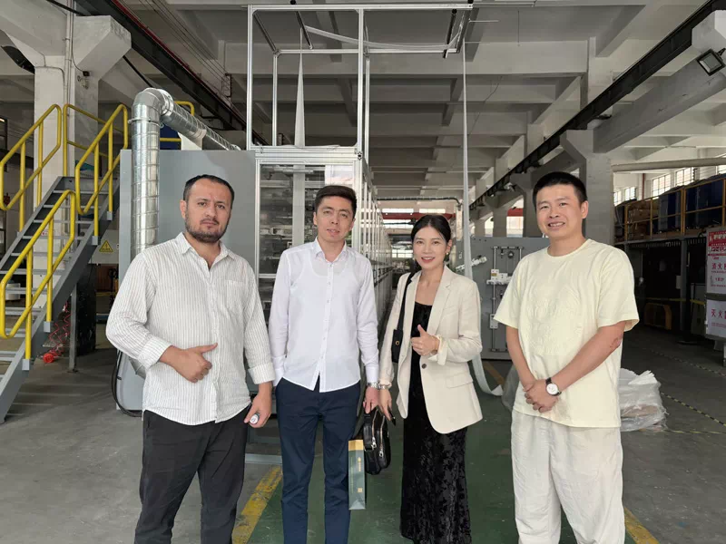 Customers from Uzbekistan Inspect Sanitary Napkin Production Line